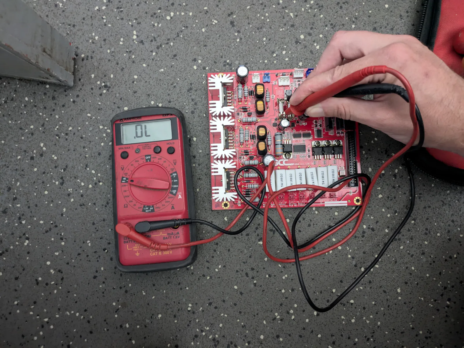 GCC Jaguar V driver board connected to a digital multimeter during testing