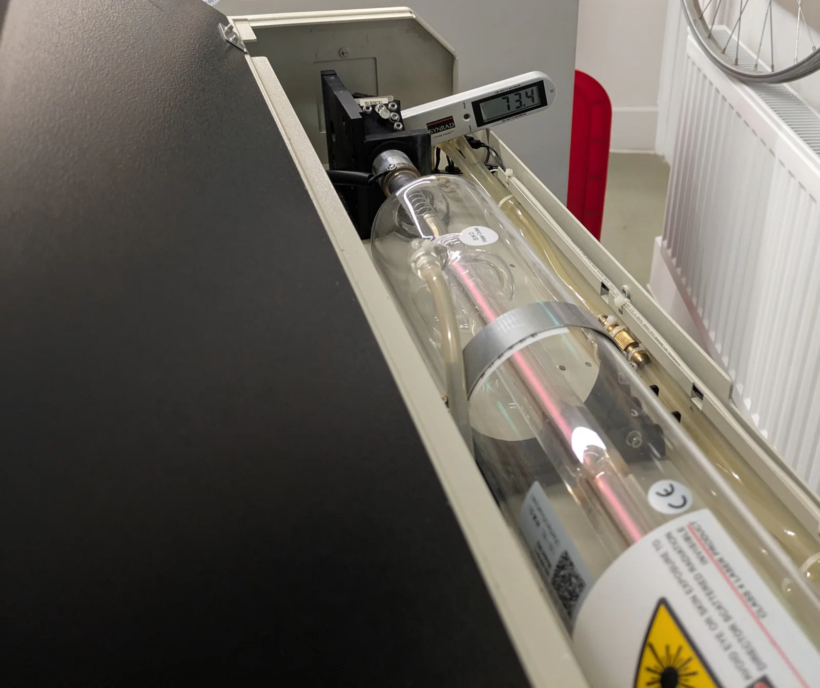 GCC X252 laser tube with a Synrad power meter positioned above it